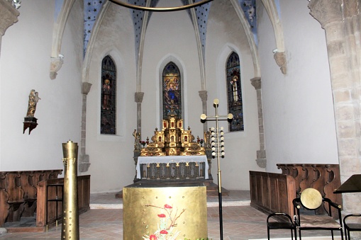 Lectern. a high table with a sloping top for liturgical books, crosses and icons in an Orthodox Church. it is circled around at the wedding.