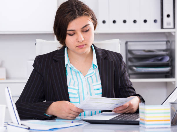 istock Woman is reading documents about the transaction 1089295470
