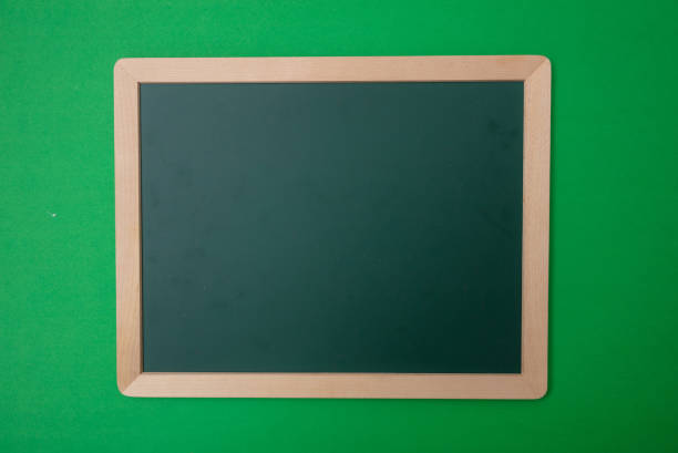 istock Green blank empty chalkboard with wooden frame, green wall background, copy space 1089299208