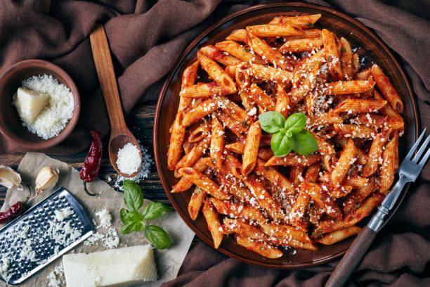 istock penne arrabiata on a plate, close up 1089299552