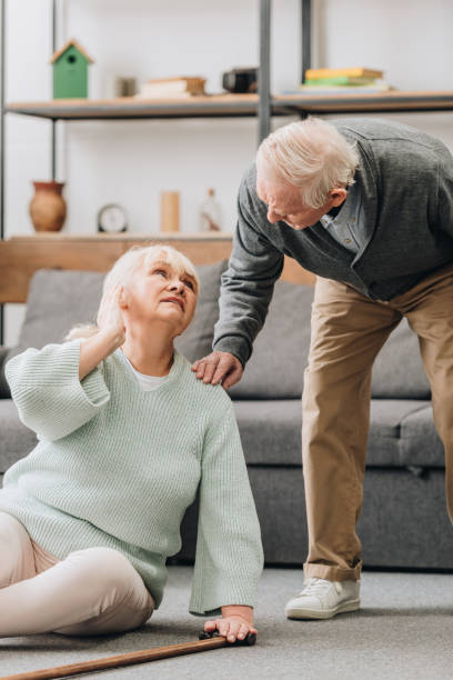 istock senior wife sitting on floor and looking at supportive retired husband 1089300526