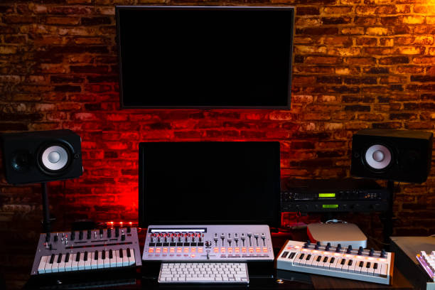 istock home studio. midi keyboard synthesizer, computer and digital recording equipment in sound studio for post production, editing, sound design, film score in music production and movie industrial 1089303542
