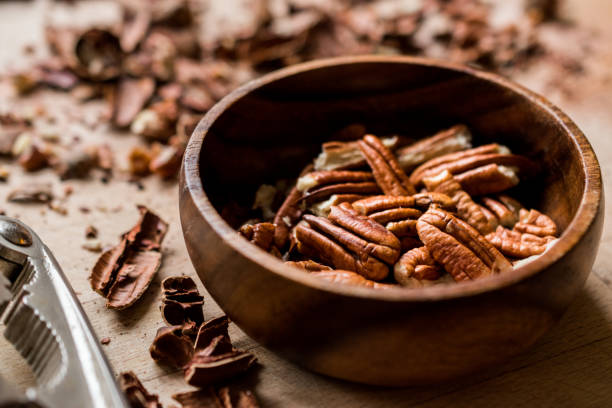 istock Peeled Pecan Nuts in Wooden Bowl without Shell / Walnuts. 1089305472