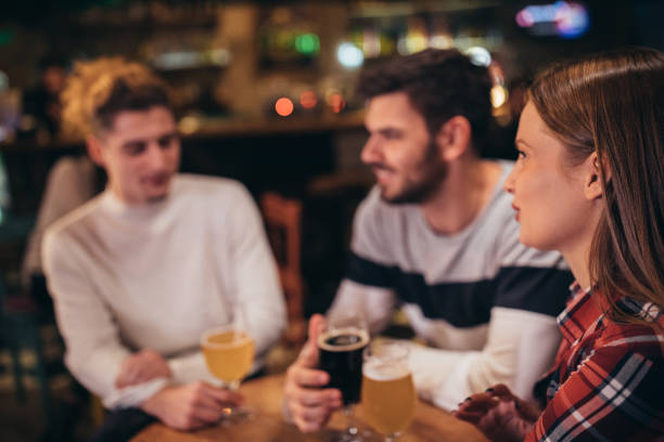 istock Friends drinking beer in bar 1089308308