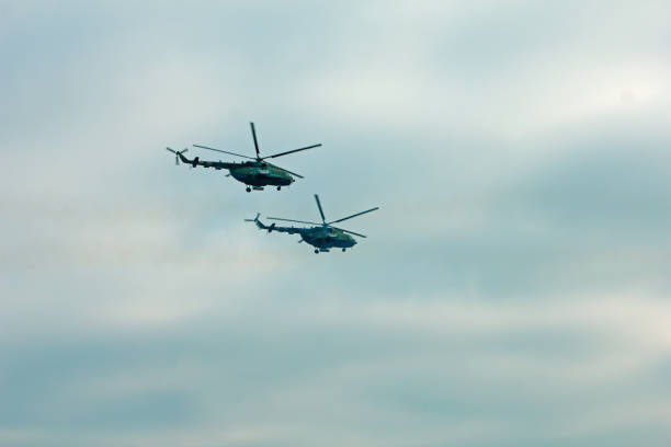 istock Helicopter in flight at sunset above war field 1089310394
