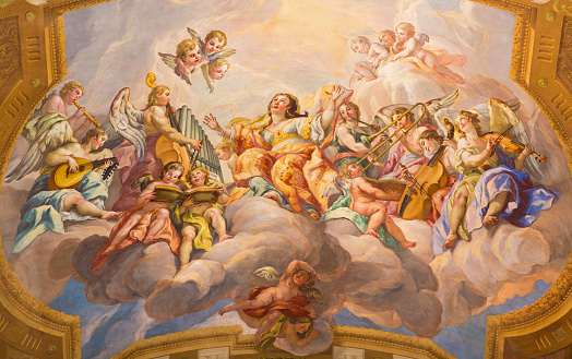 Vienna - The symbolic fresco of woman wiht the angels and music instruments in baroque church of St. Charles Borromeo by Johann Michael Rottmayr.