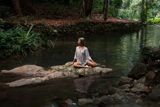 Photo of Beautiful young woman enjoys  in nature