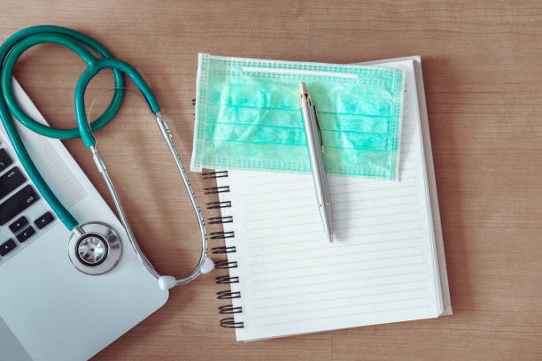 istock Stethoscope on doctor office table and equipment tools, Table workspace desktop for examining patient health., Science and technology, Business healthcare and medicine top view concept. 1089314732