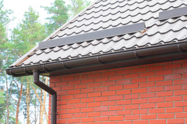 istock Metal roofing construction with  rain gutter system  and roof protection from snow board. 1089314916