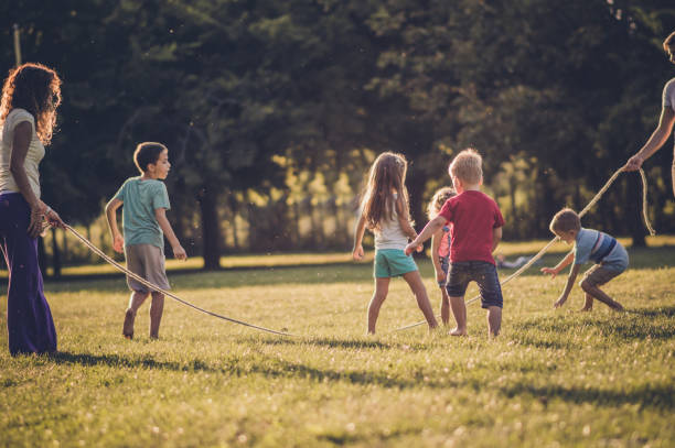 istock Group of children playing in public park 1089316526