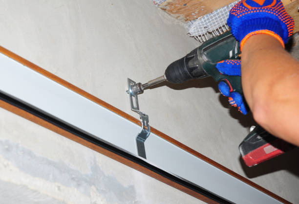 istock Building contractor Installing garage door opener. 1089316656