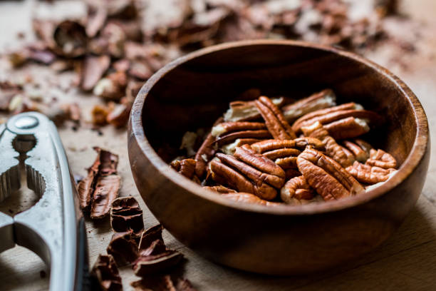 istock Peeled Pecan Nuts in Wooden Bowl without Shell / Walnuts. 1089316664