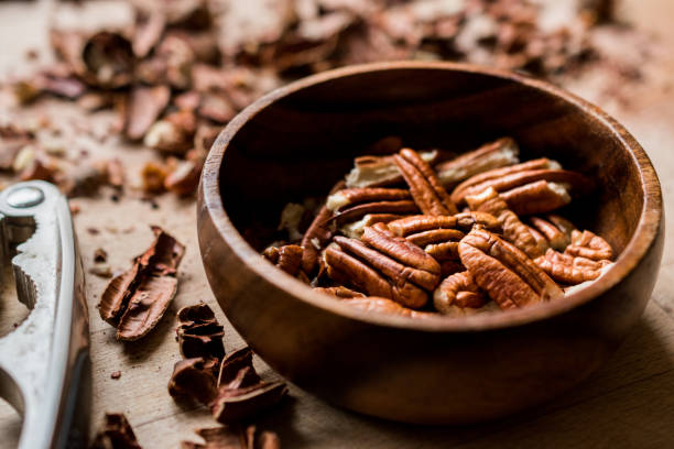istock Peeled Pecan Nuts in Wooden Bowl without Shell / Walnuts. 1089317998