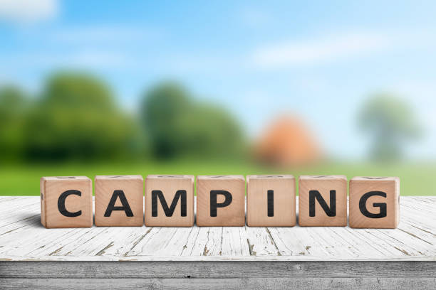 istock Camping word on a wooden cube sign 1089322744