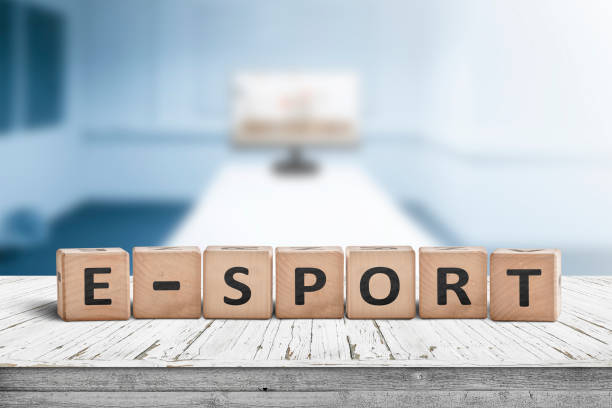 E-sport sign on a desk in a blue room with a blurry background