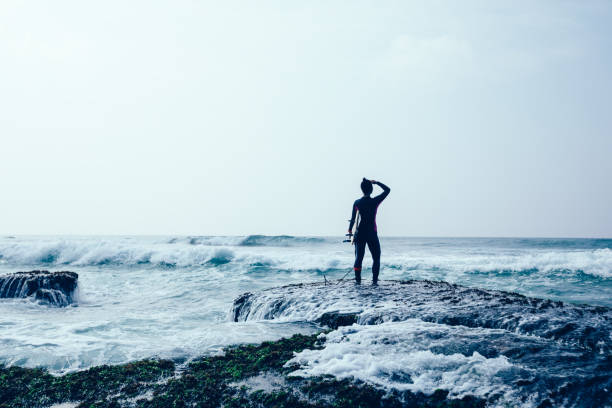 istock Woman surfe with surfboard on mossy coral reefs 1089325242