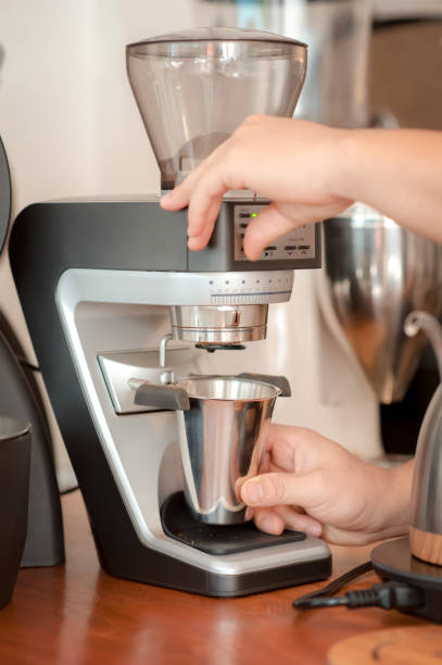 istock Barista hand making coffee with Coffee grinder 1089327542