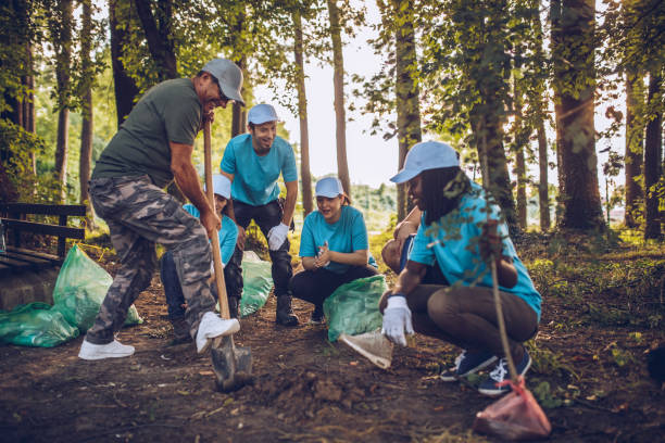 istock Volunteers planting a tree in park 1089337154