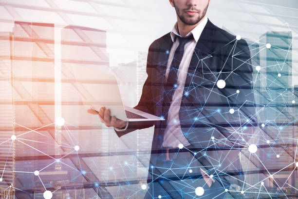istock Businessman with laptop in city, network 1089343246