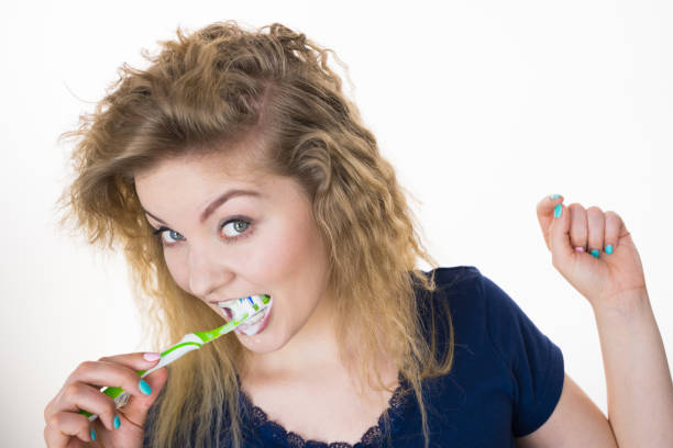 istock Woman brushing cleaning teeth 1089344220