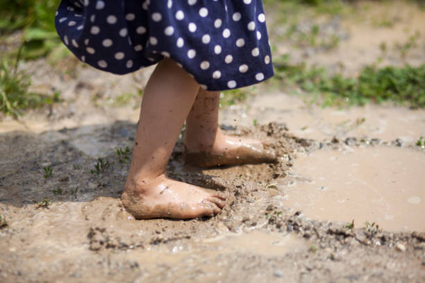 istock Girl playing in mud 1089346248