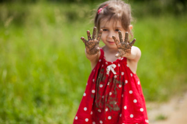 istock Girl playing in mud 1089346262