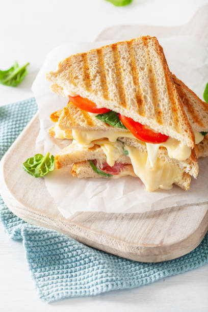 istock grilled cheese and tomato sandwich on white background 1089346280