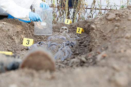 Exhumation: Forensic science specialist at work