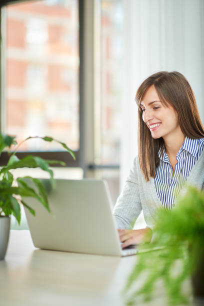istock Caucasian businesswoman using laptop in office. 1089349334