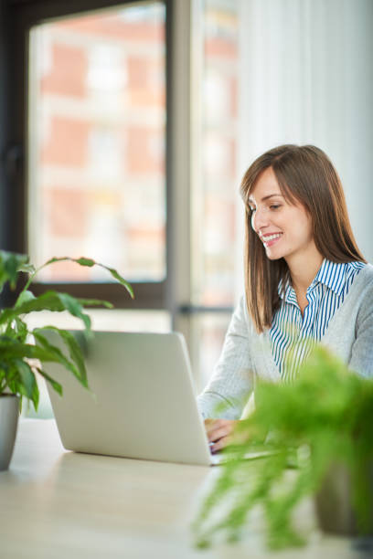 istock Caucasian businesswoman using laptop in office. 1089349336