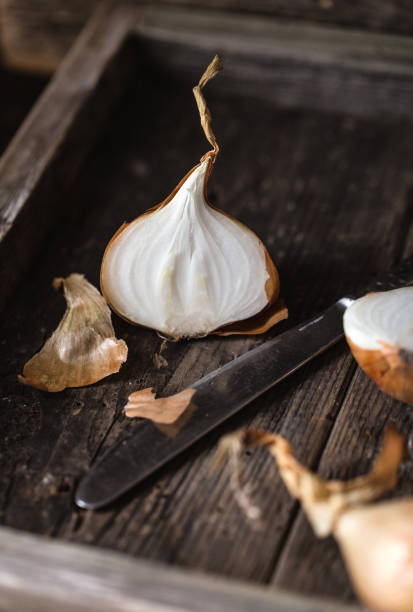 istock Fresh onions on rustic wooden background. Onions background. Ripe onions. 1089350268