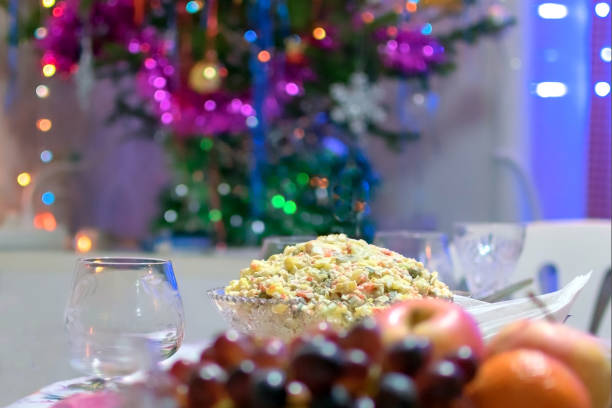 Olivier Salad. Russian salad with variable ingredients, made with chopped vegetables, meat, and mayonnaise.