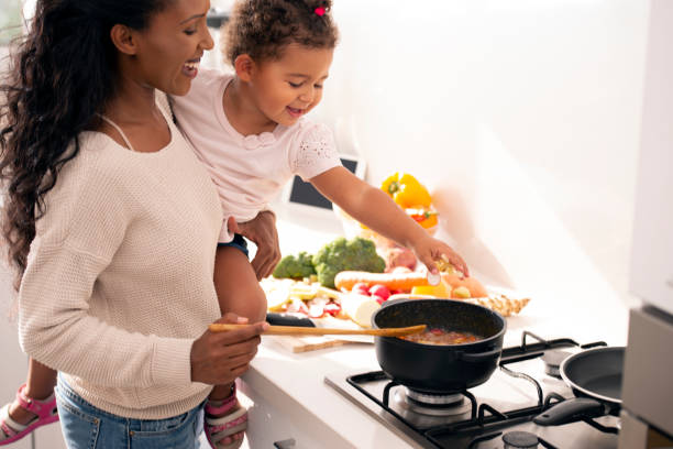 istock Mother and daughter cooking a soup. 1089352792