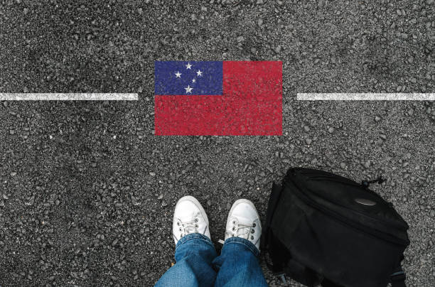 istock a man with a shoes and flag of Samoa 1089359012
