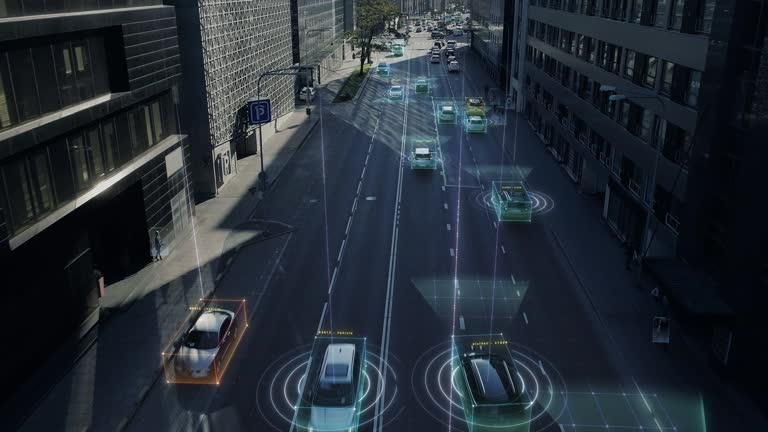 Aerial Drone Shot: Autonomous Self Driving Cars Moving Through City. Concept: Artificial Intelligence Scans Surrounding Environment, Detecting Cars, Pedestrians, Avoids Traffic Jams and Drives Safely.