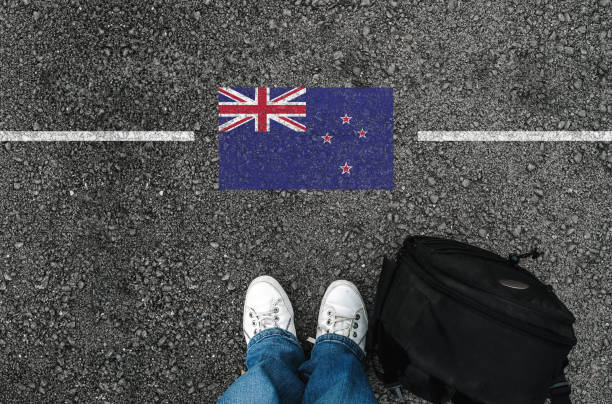 a man with a shoes and flag of New Zealand stock photo