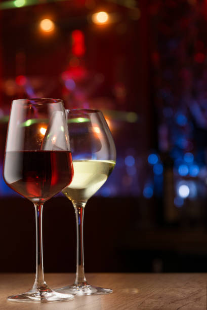 istock Celebrating in the bar, two wineglasses on bar counter 1089364532