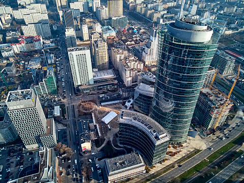 Beautiful panoramic aerial drone view to the center of Warsaw City and The Warsaw Spire - 220 metre neomodern office building on European square (Plac Europejski)