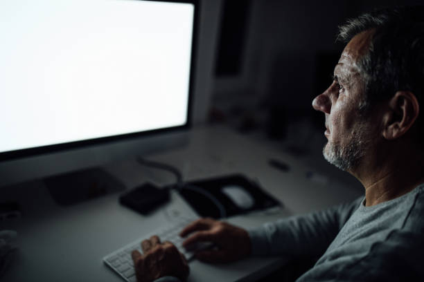 istock Businessman working late at the home office 1089367628