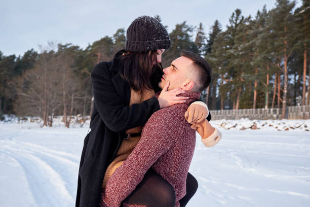 istock Young passionate couple hugging on a winter day on the park. 1089367968