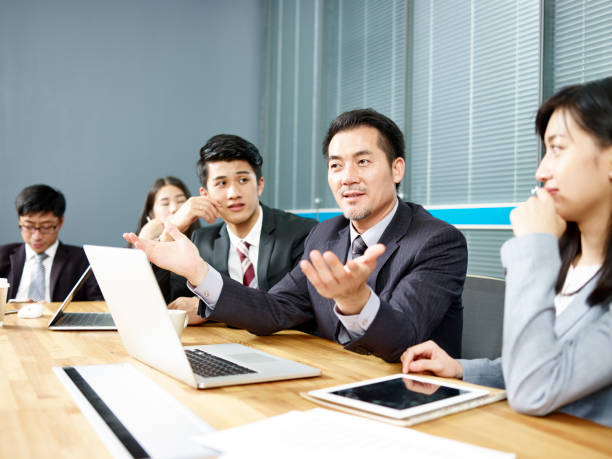 istock asian corporate executive negotiating with client 1089368052