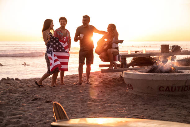 Family party on the beach in California at sunset Family party on the beach in California at sunset family bbq beach stock pictures, royalty-free photos & images