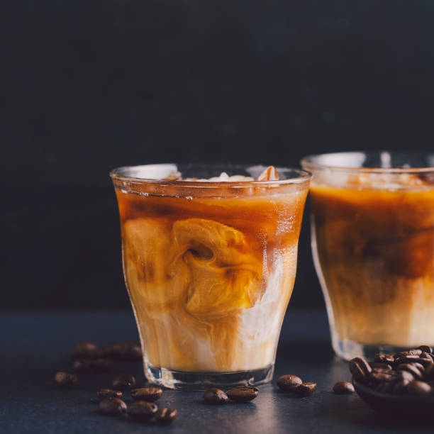 Cold coffee with milk in glasses