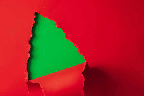 istock Christmas tree shape made with red and green paper. 1089379562
