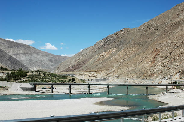 istock Tibetan landscape with river and bridge 1089380860