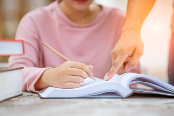 istock Young students campus helps friend learning. People, learning, education and school concept. 1089382596