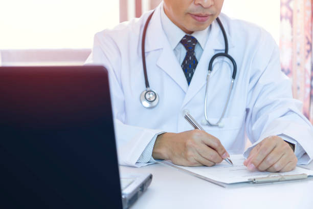istock Doctor and a patient record 1089385564