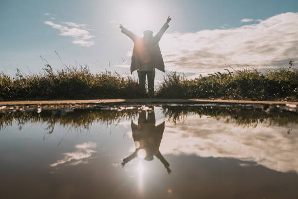 istock Young woman and her reflection on the water 1089388072