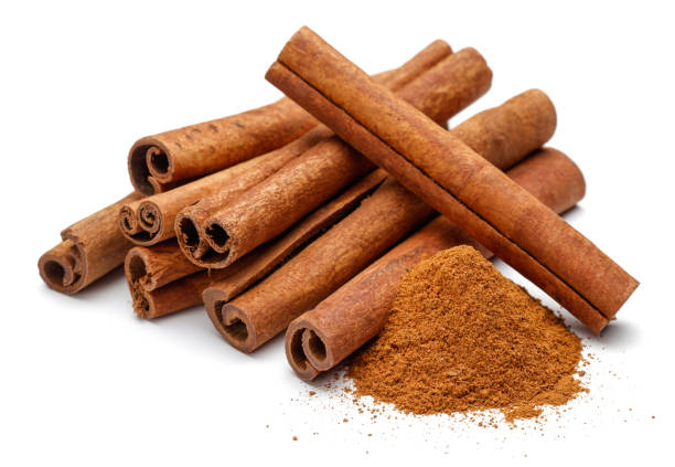 istock Cinnamon sticks and powder on white background 1089393068
