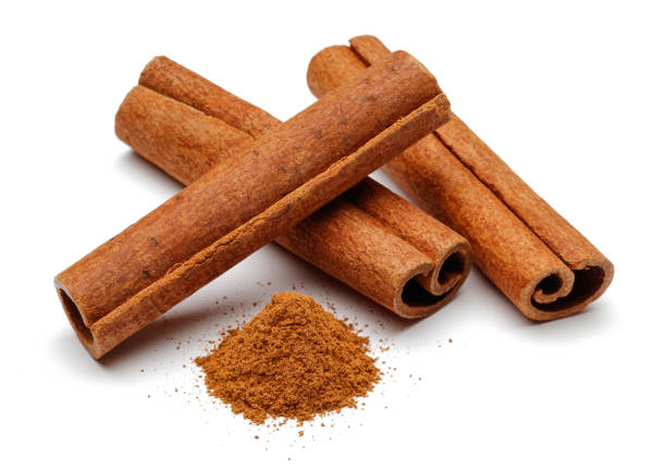 istock Cinnamon sticks and powder on white background 1089394172